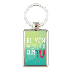 "EL MÓN NECESSITA GENT COM TU" Clauer rectangular metàl·lic